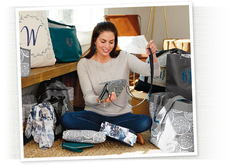 Host and guests looking at Thirty-One bags